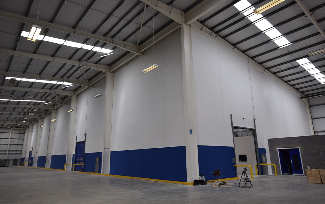 Blue and white floor to ceiling Flexiwall with fast action doors 